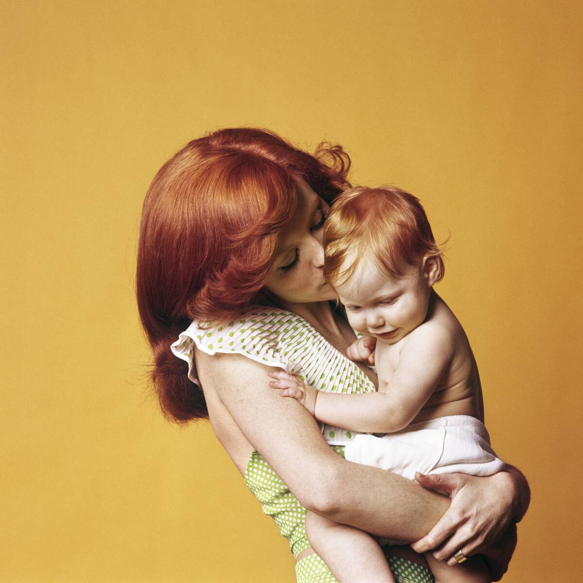 1970s Pensive Smiling Mother with Child