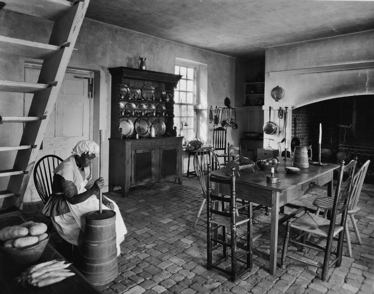 A Woman Churns Butter