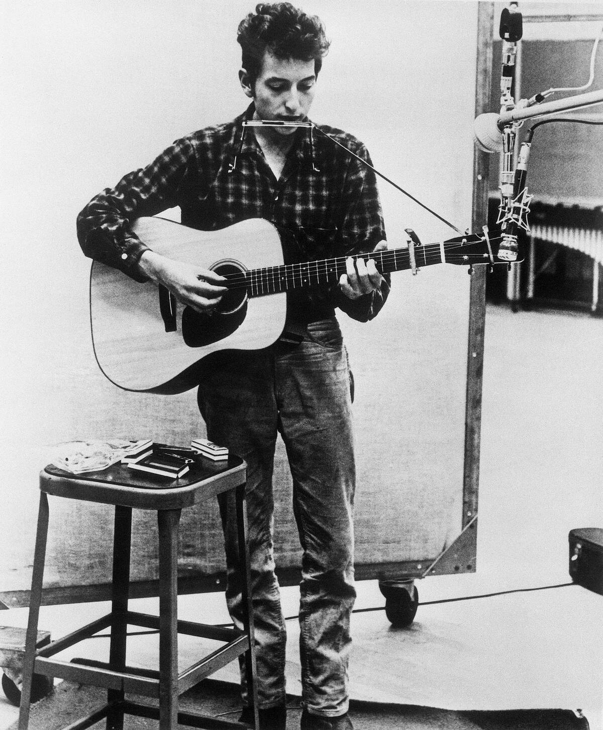 Bob Dylan Playing Harmonica and Guitar