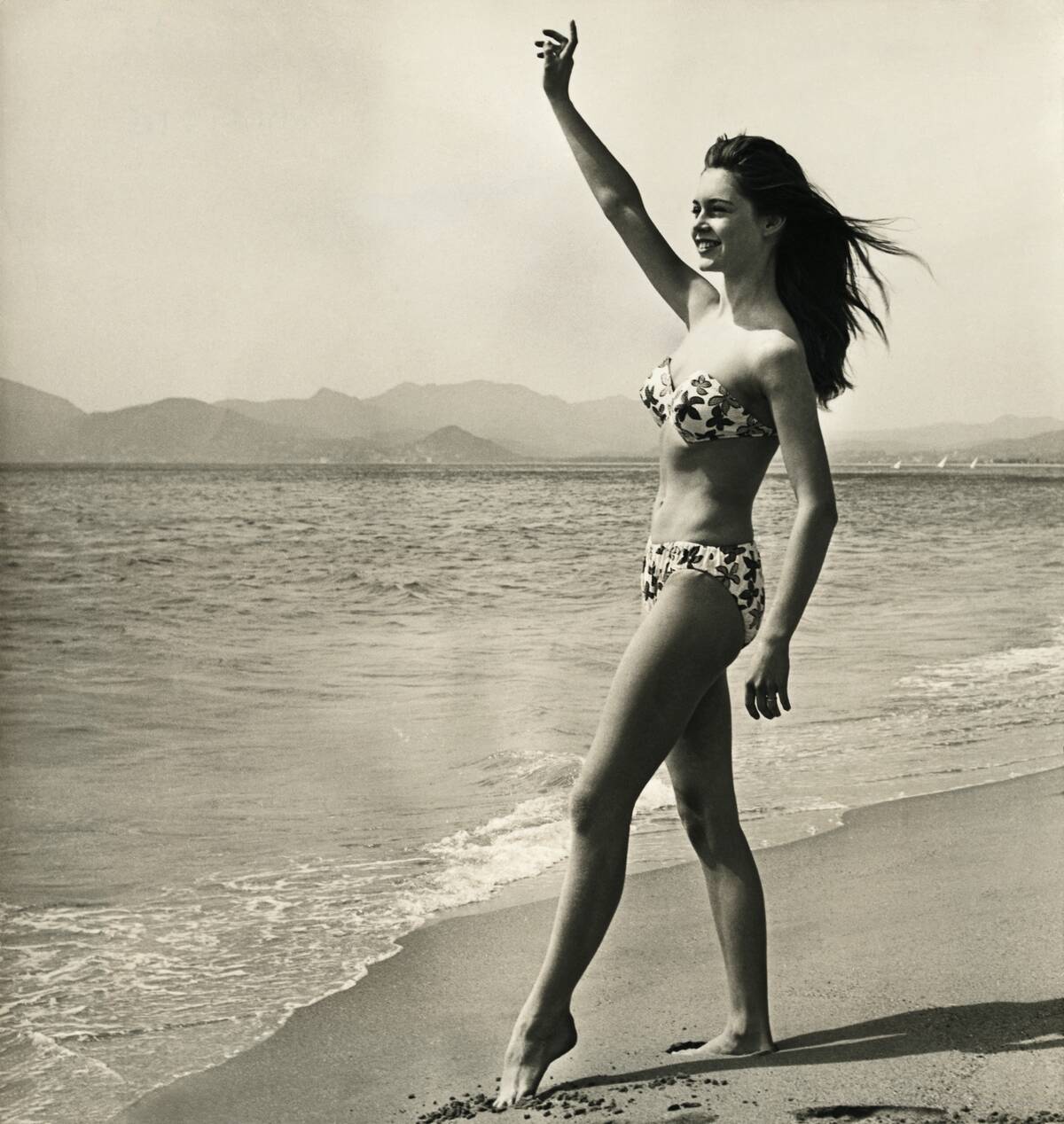 Brigitte Bardot Waving on the Beach