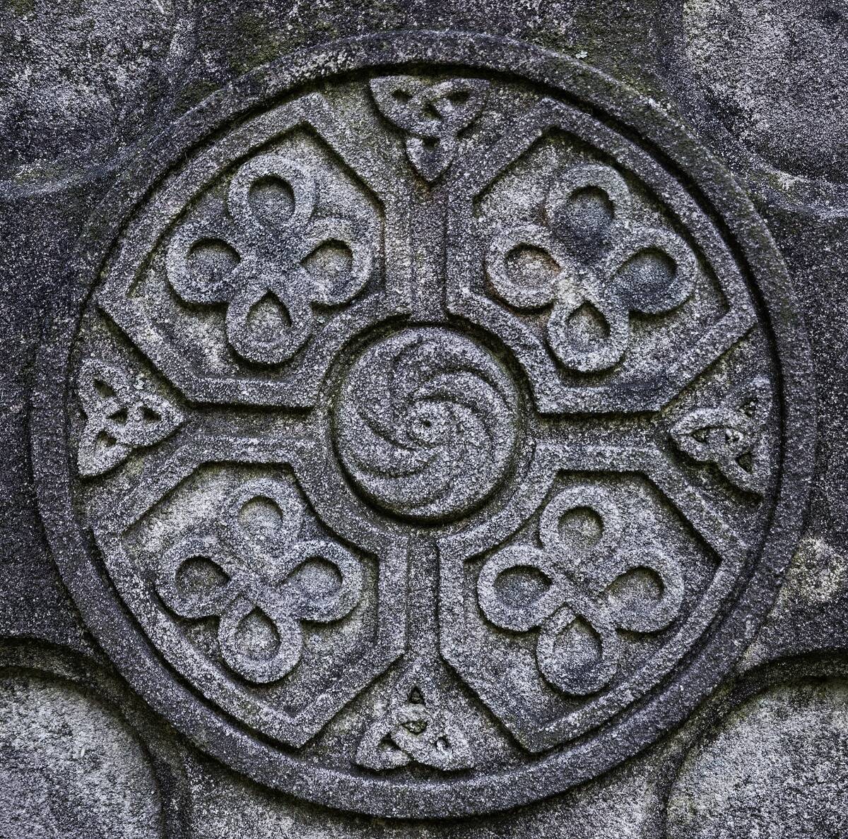 Celtic cross detail with knot symbol designs...