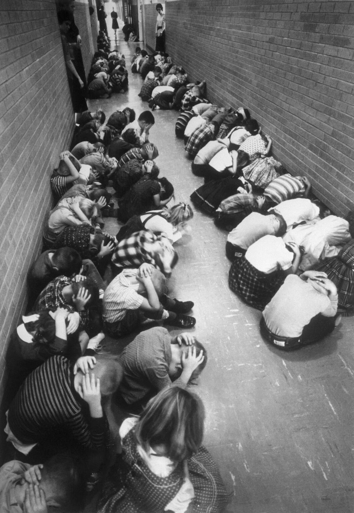 Children Practicing Emergency Measures in School Hallway