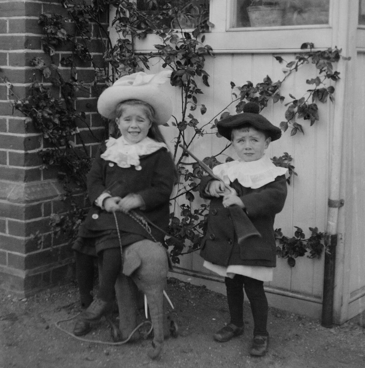 Children With Toys In Garden