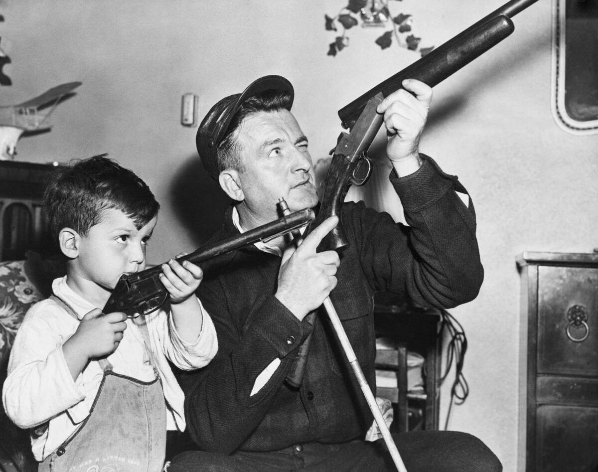 Father Teaching Son About Guns
