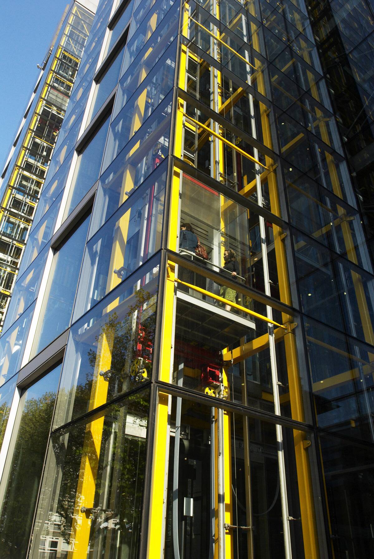 Glass lifts at 'Waterside', designed by Richard Rogers Partnership and houses the headquarters of Marks & Spencer, Paddington Basin, West London, UK