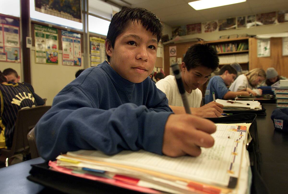 In Thousand Oaks, Redwood Middle school student, Oliver Lopez, records his homework in his agenda bo