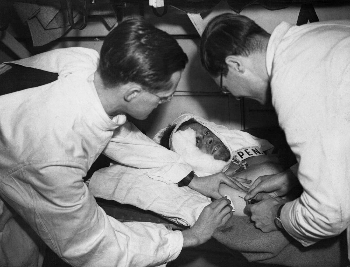 Injured British Soldier Conversing with Medics