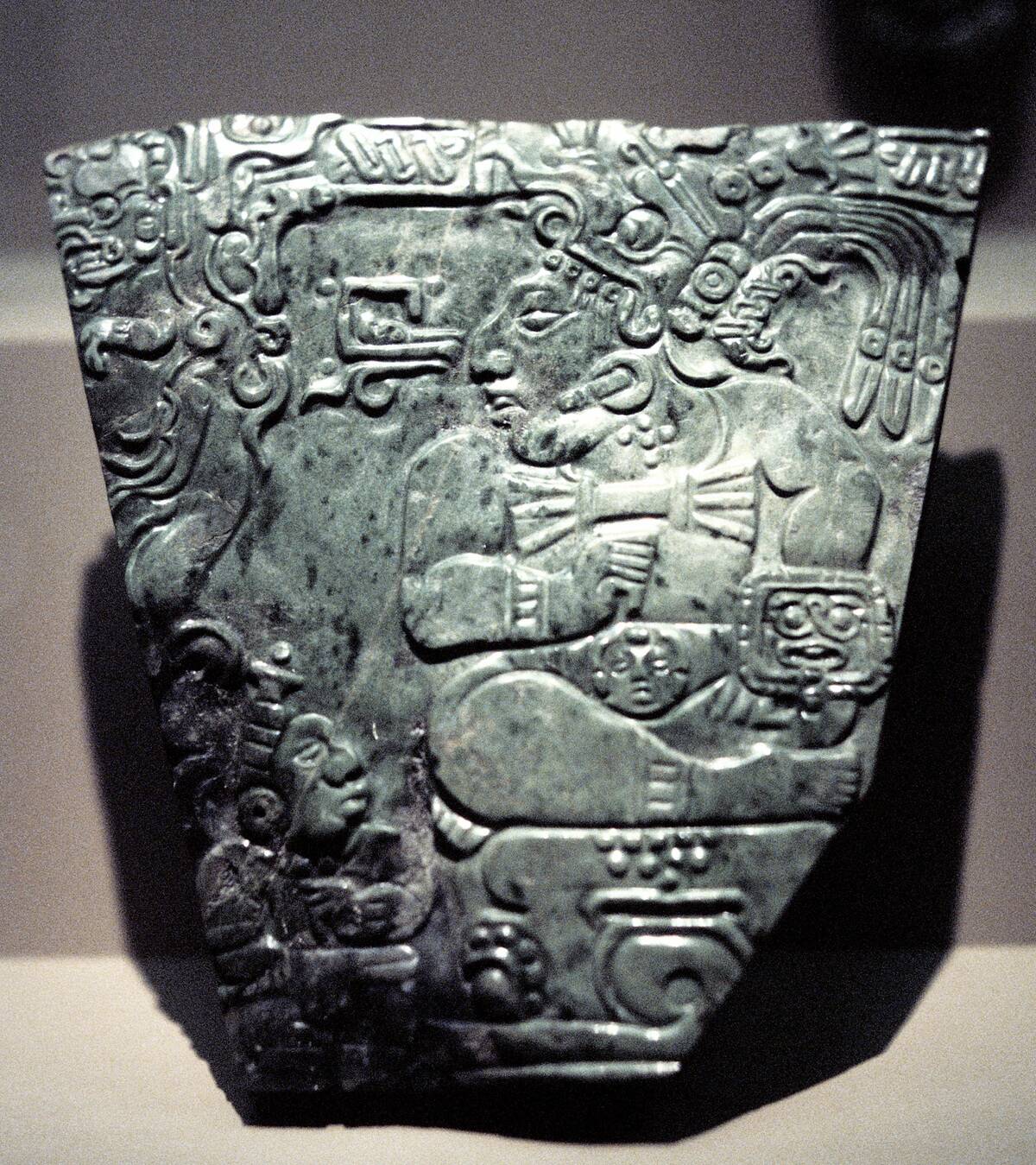 Jade plaque showing a seated Mayan king, 400-800.