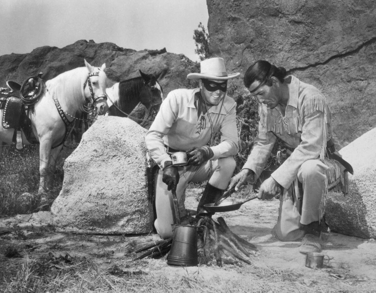 Lone Ranger and Tonto Characters Cooking Food over Camp Fire
