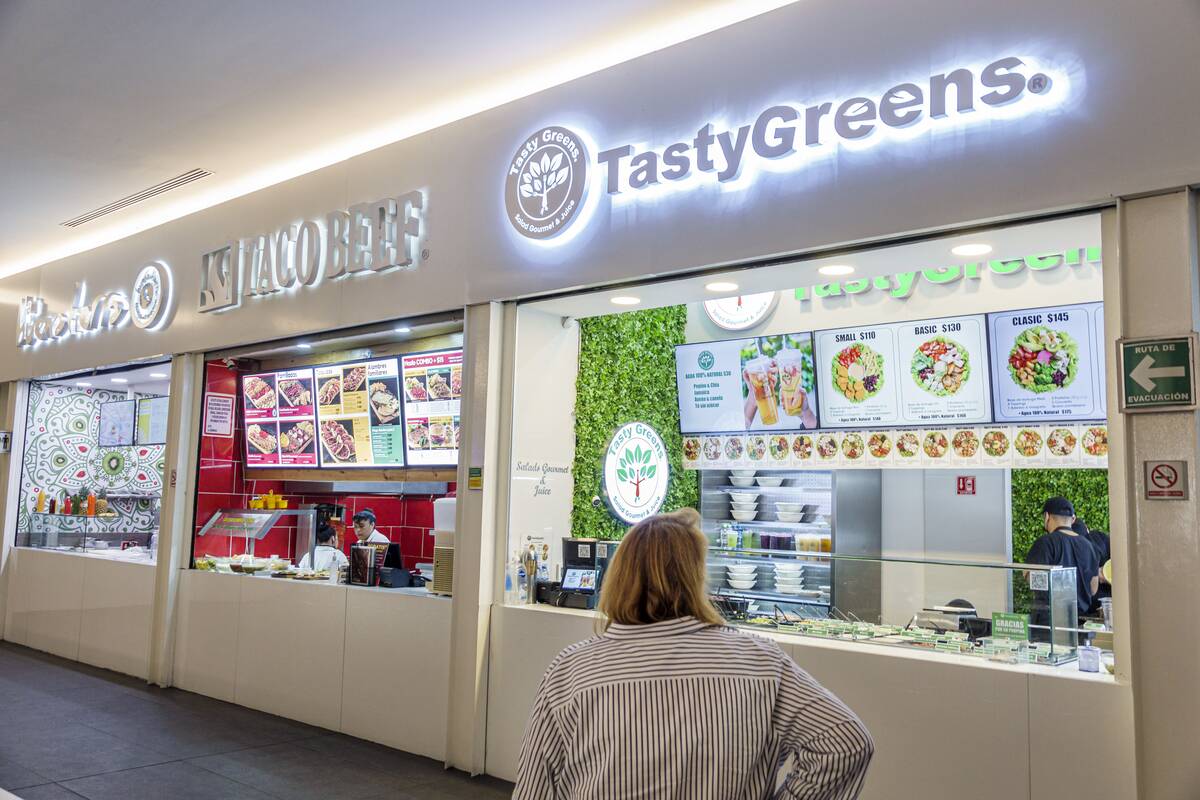 Mexico City, Mexico, Reforma 222 Shopping Center, food court customer looking at menu for Tasty Greens and Taco Beef