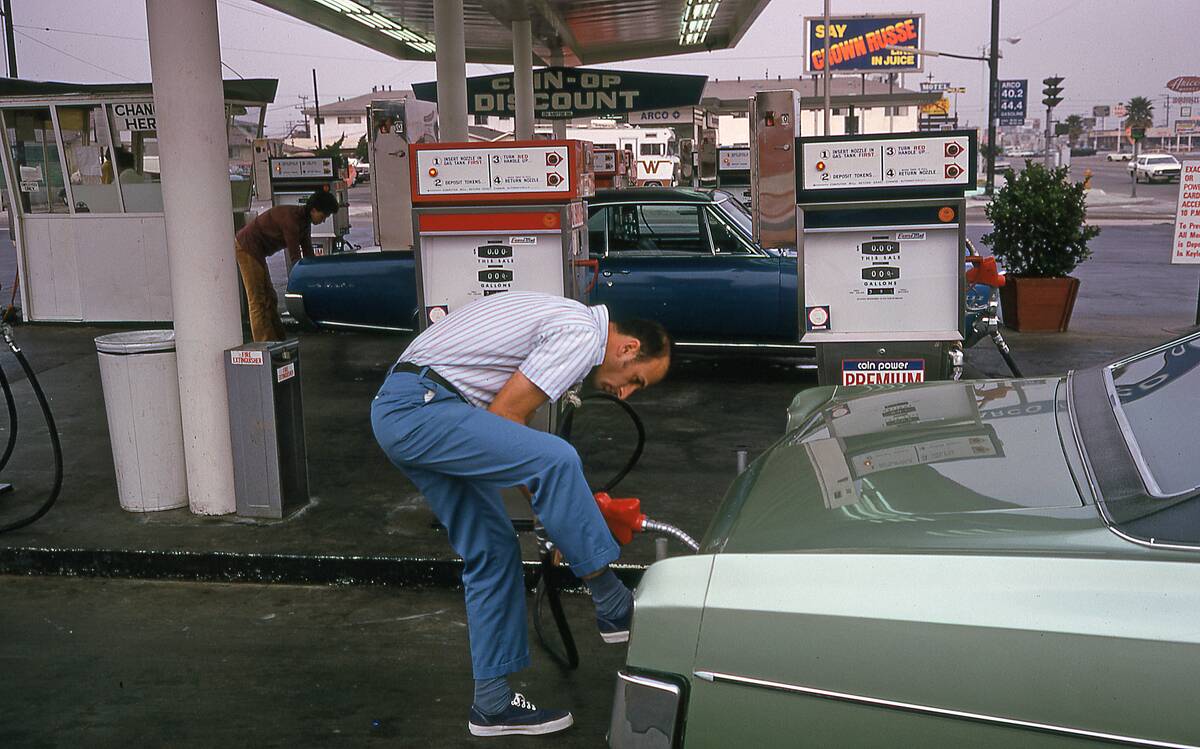 Motorists Refueling At A Gas Station