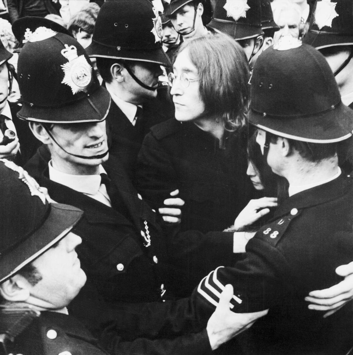 Police Surrounding John Lennon and Yoko Ono