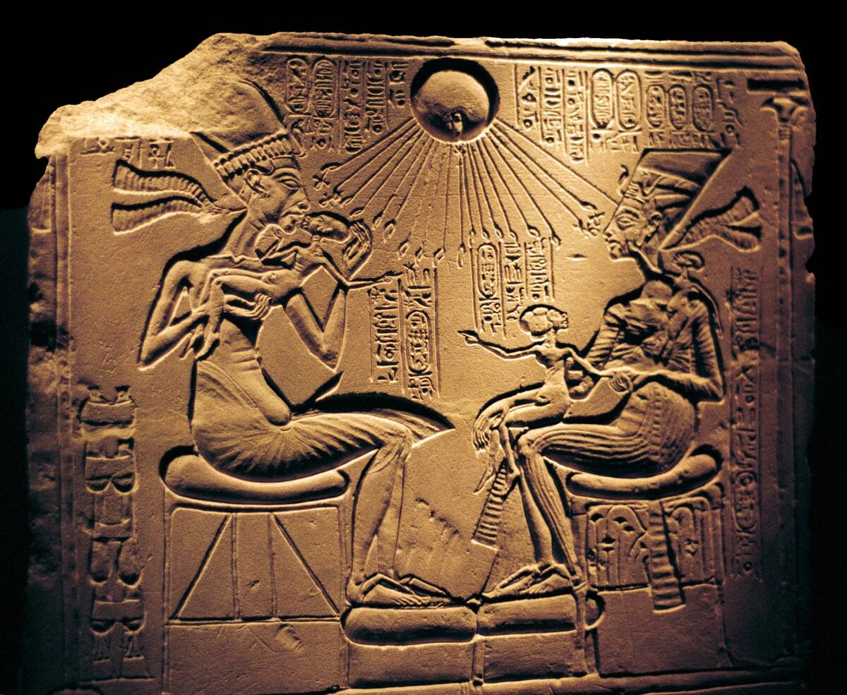 Relief showing Nefertiti (c1370-c1330 BC) Great Royal Wife (chief consort) and the Egyptian Pharaoh Akhenaten, and their children, with Aten, the sun's disc which they worshipped.