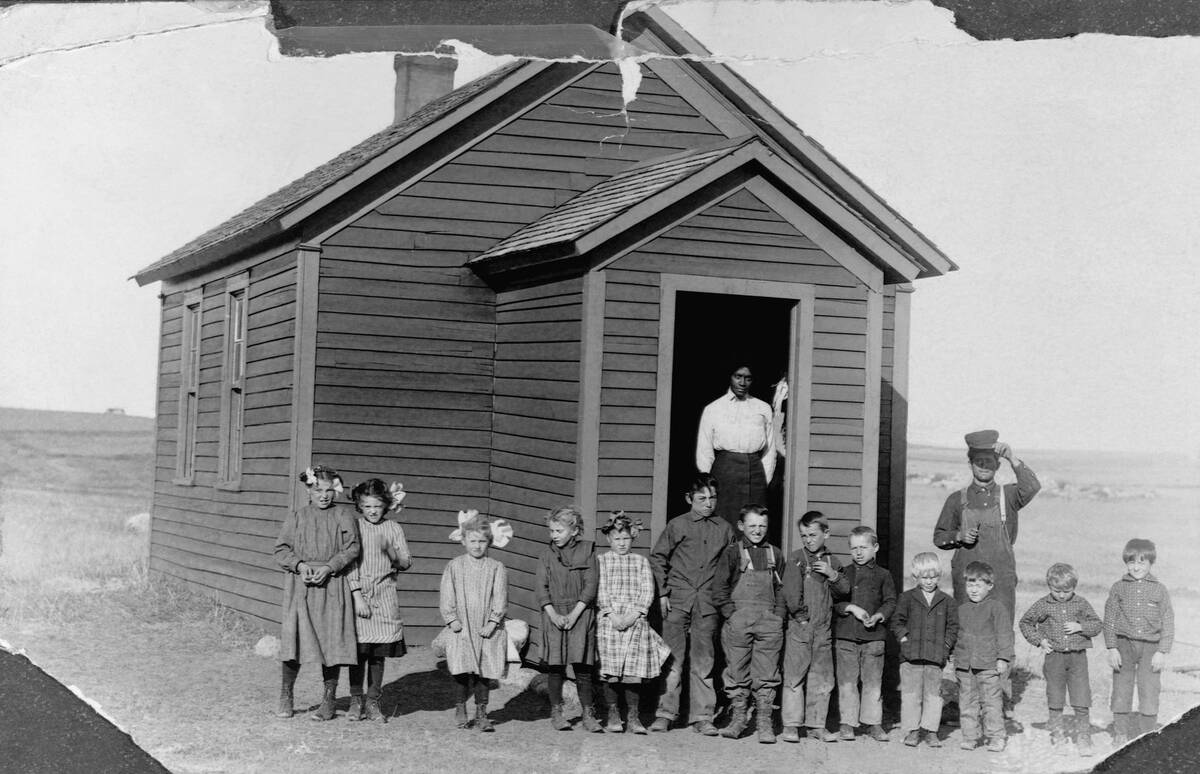 Teacher and Students at Schoolhouse
