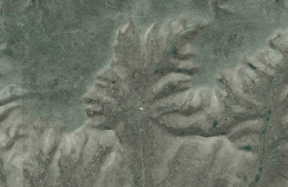 This is a cropped DigitalGlobe image of Indian Head, the Badlands Guardian, near Medicine Hat in Alberta, Canada.