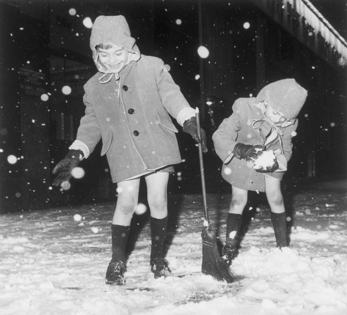 Twins Playing in Snowstorm in New York City