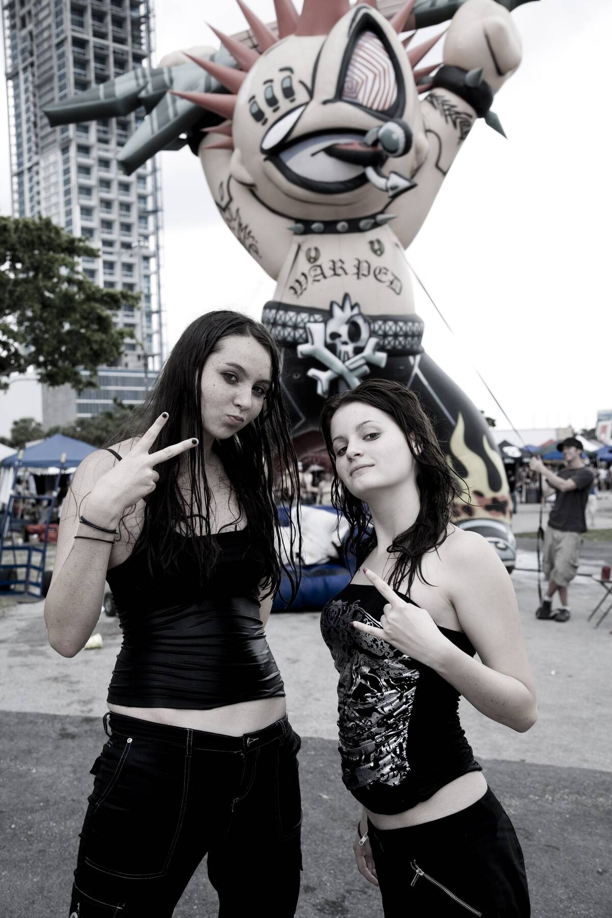 Two punk girls looking at the camera. Vans Warped Tour, USA touring punk rock music festival, Bicentennial park, Miami, Florida, USA. 24th June 2006