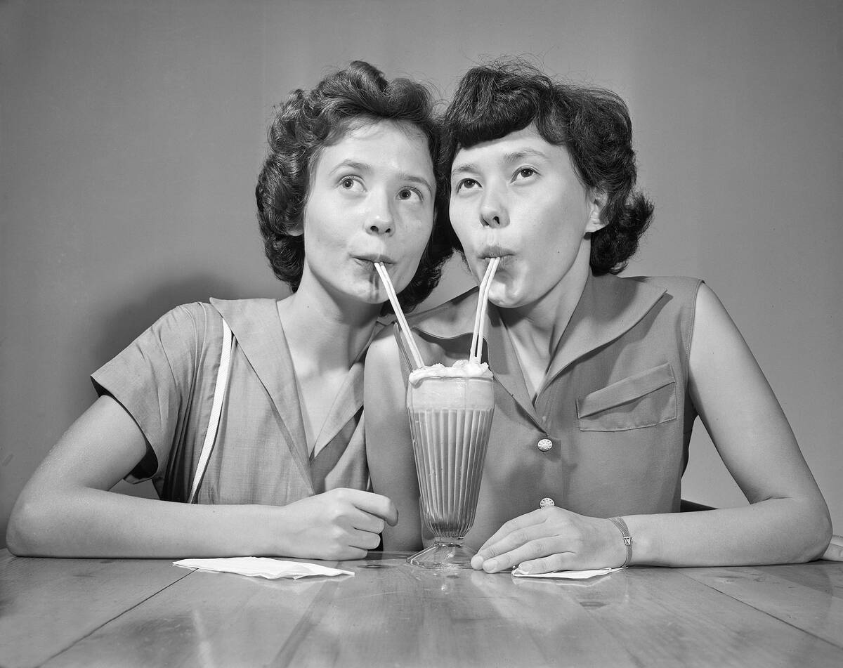 Two Sisters Drinking a Ice Cream Soda