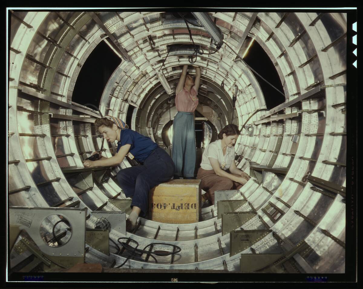 Women Workers Install Fixtures And Assemblies To A B-17 Bomber