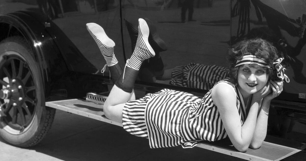 Young Woman in Striped Bathing Suit