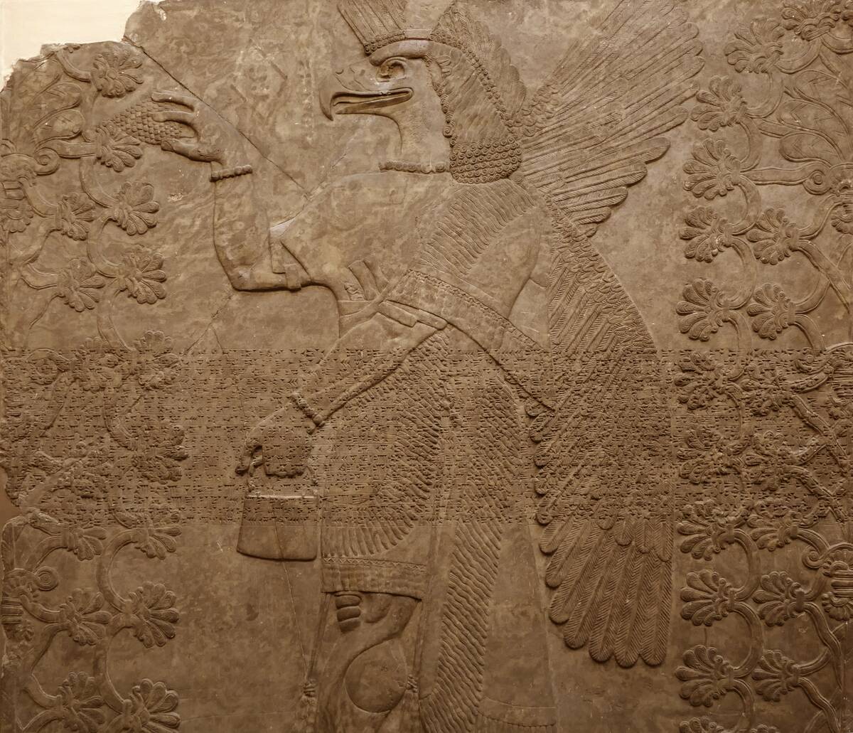 Assyrian protective spirit , 865-860 BC From the North-West Palace, Nimrud, Iraq. Th e four-winged spirit, holding a mace, guarded one of the doors into the royal throne room