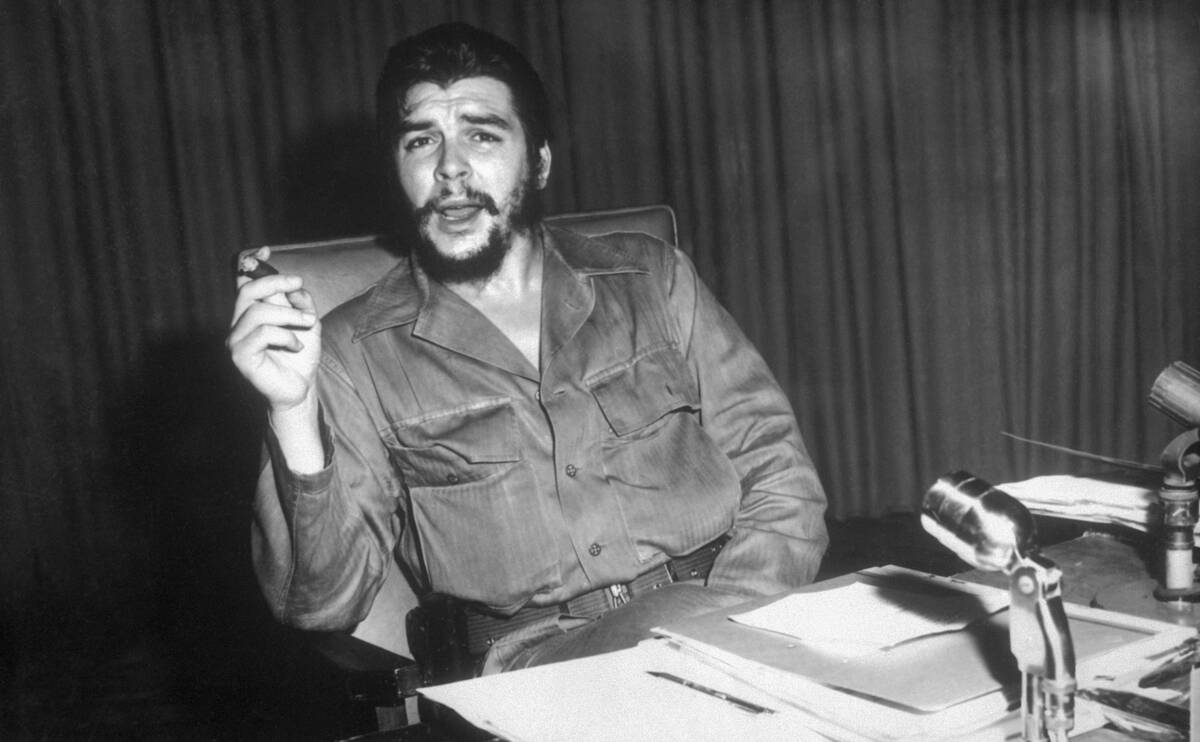 Che Guevara Sitting at a Desk
