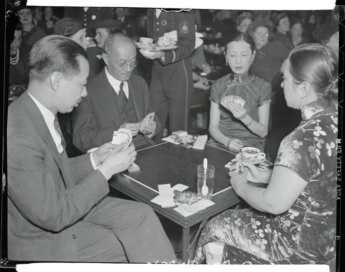 Chinese Officials Relaxing With Deck of Cards