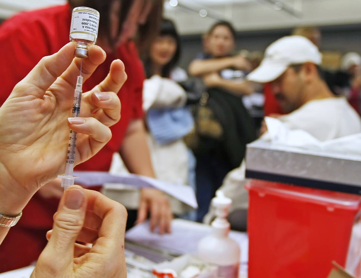 Crowds Line Up For H1N1 Vaccinations