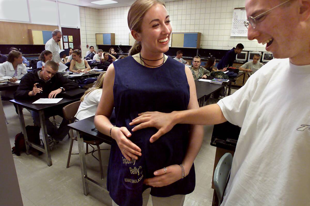 Erik (cq) Jarrin age 17 touches the empathy belly on Crystal Wilkinson age 17 which simulates a preg