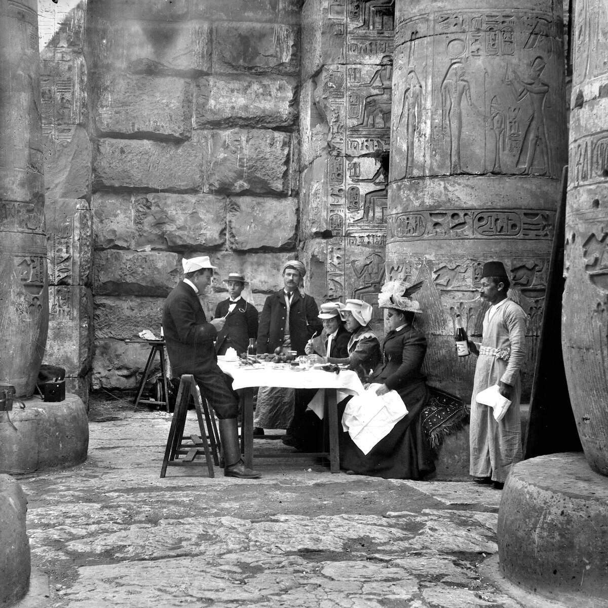 European tourists having a picnic in a temple, in