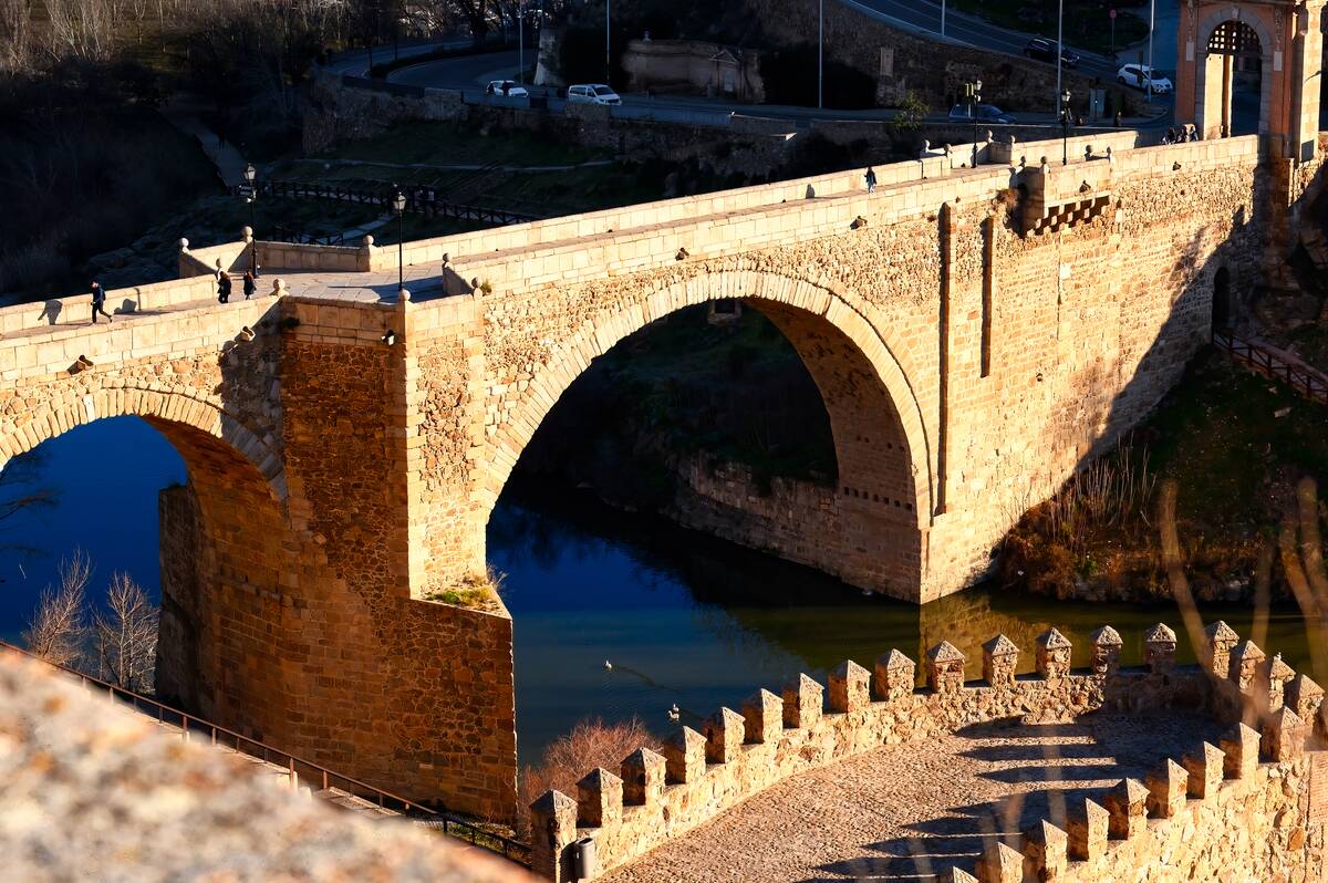Medieval Alcántara Bridge at the entrance of the city,...