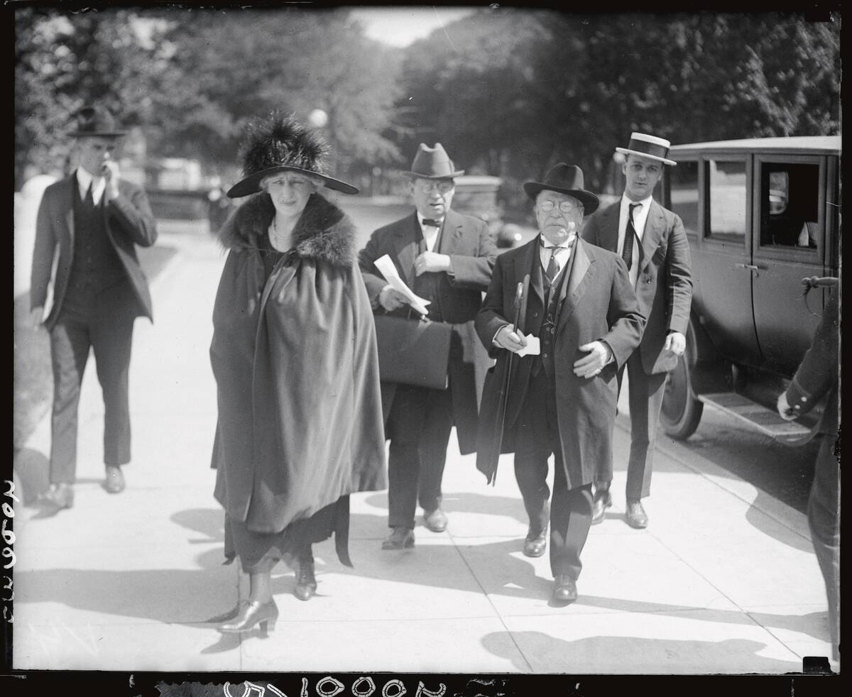 Mr. and Mrs. Samuel Gompers Walking Away from Car