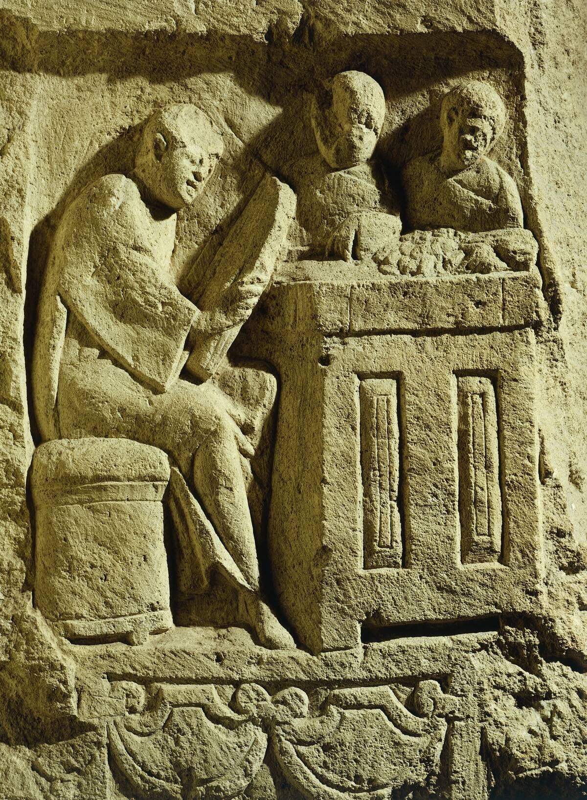 Relief depicting a merchant eager to make a deal