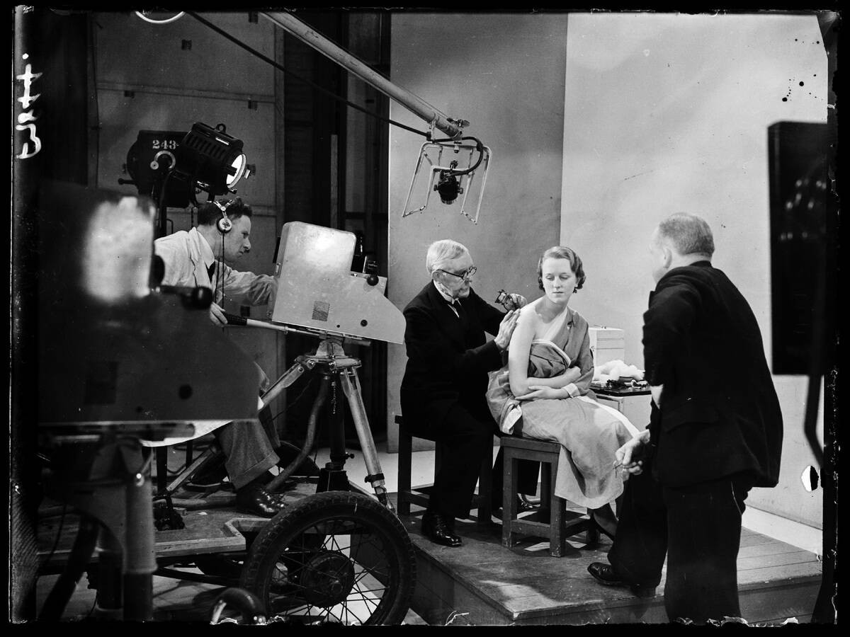 Tattooist at work in a television studio, 1938