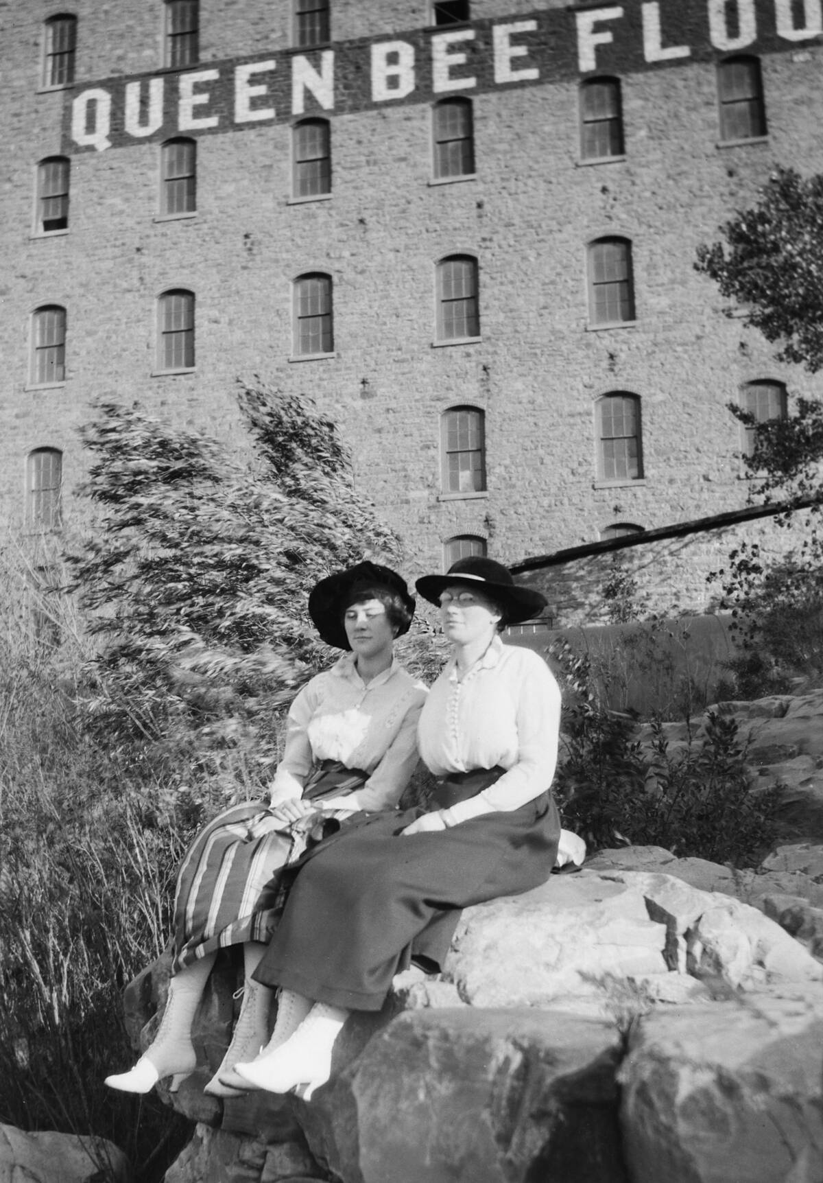 Two women outside the Queen Bee Mill in Sioux Falls, SD, ca. 1895