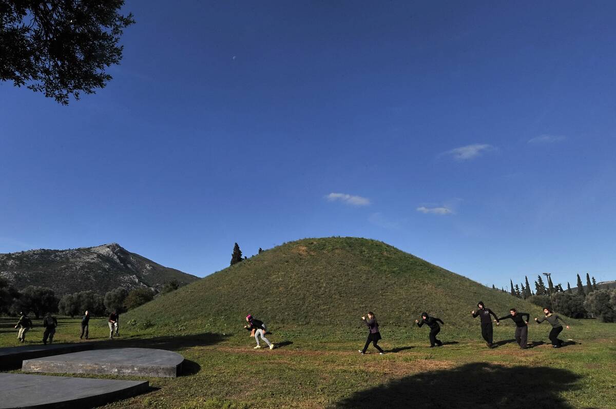 Actors perform in front of the Marathon