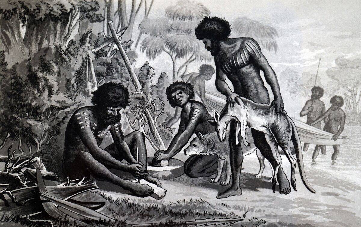 Australian aborigines preparing a meal using a bow drill