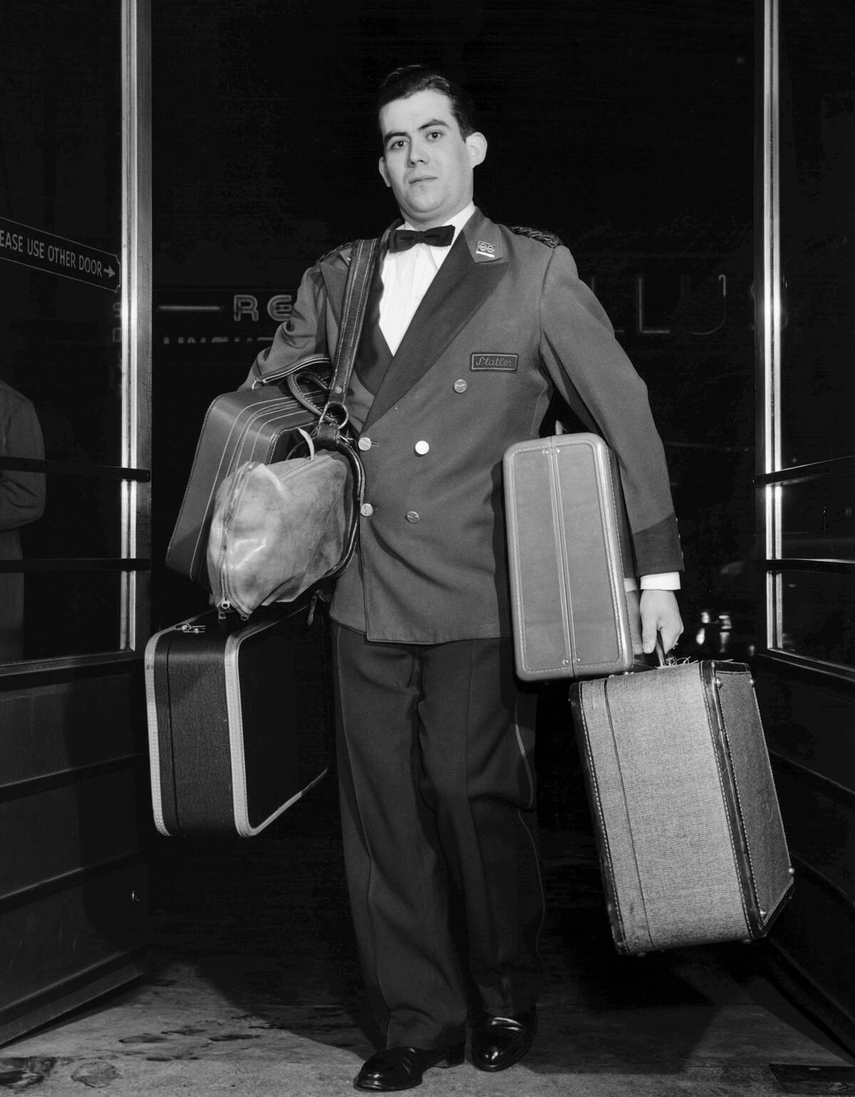 Bellhop Carrying Luggage