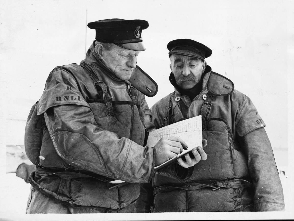 British Naval Lifeboatmen Making Log Entry