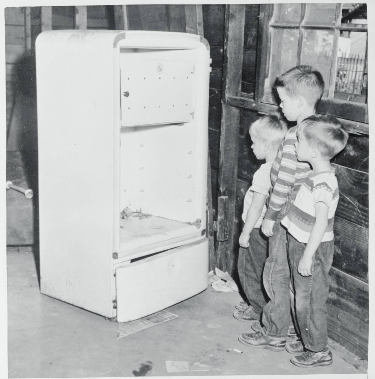 Children Looking at an Icebox