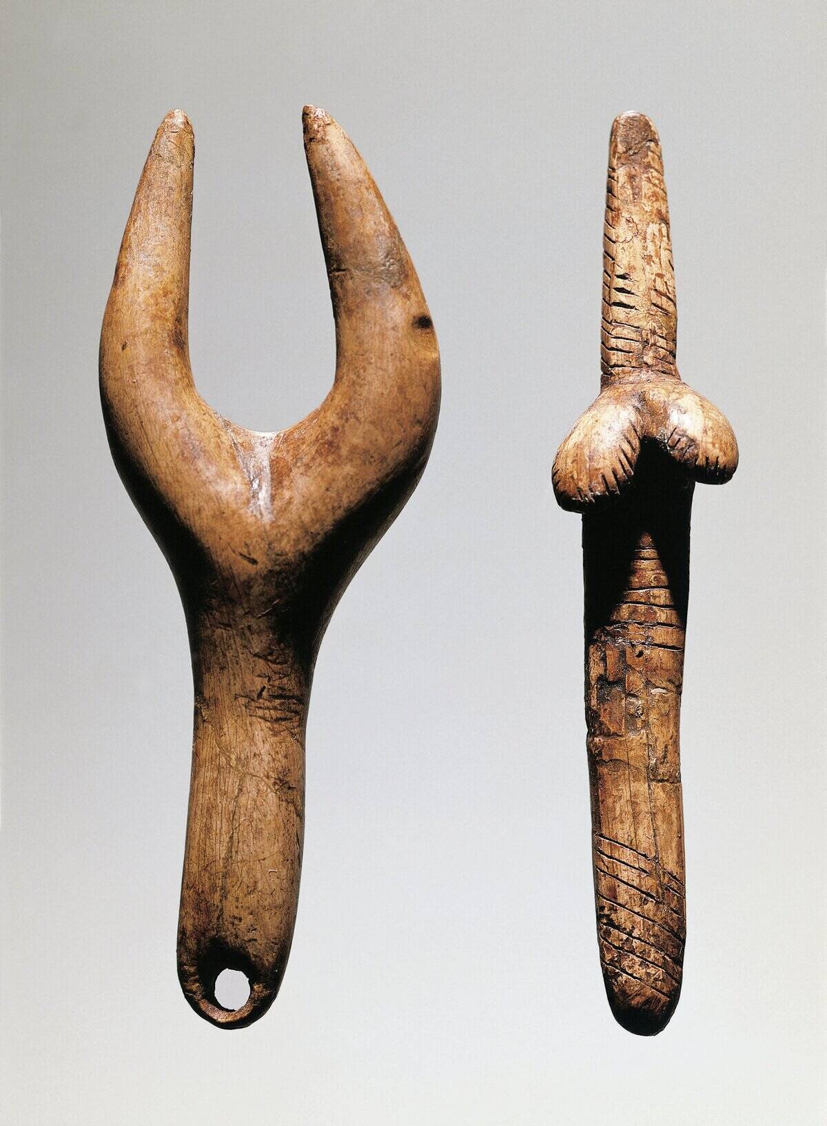 Czech Republic, Brno, Etnograficke Muzeum Moravskeho Muzea v Brne, Bone amulet and stylized female statuette from Dolni Vestonice