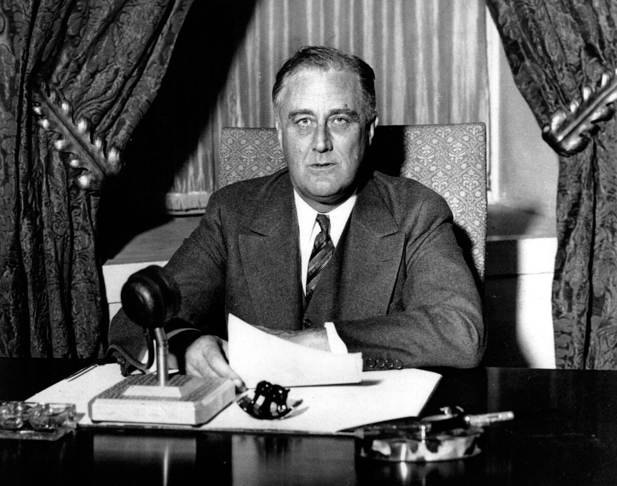 Franklin Delano Roosevelt (1882-1945), 32nd President of the United States of America 1933-1945, giving one of his 'fireside' broadcasts to the American nation during.