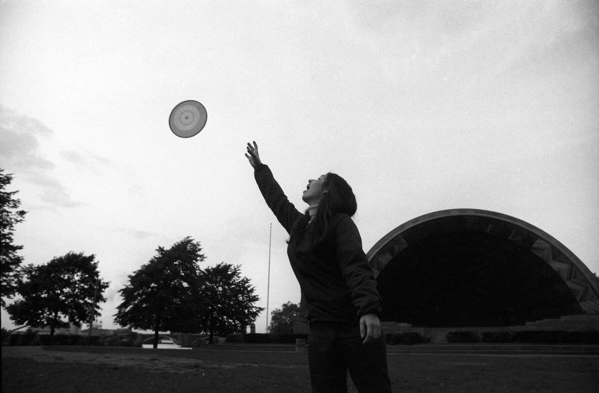 Frisbee Toss At Charles Embankment Band Shell