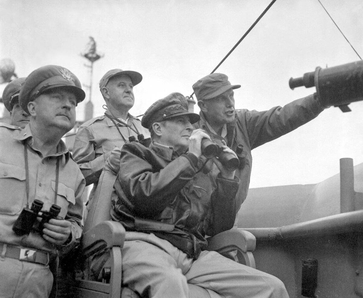 Gen. Douglas MacArthur, Commander in Chief of U.N. Forces observes the shelling of Inchon, September 15, 1950.