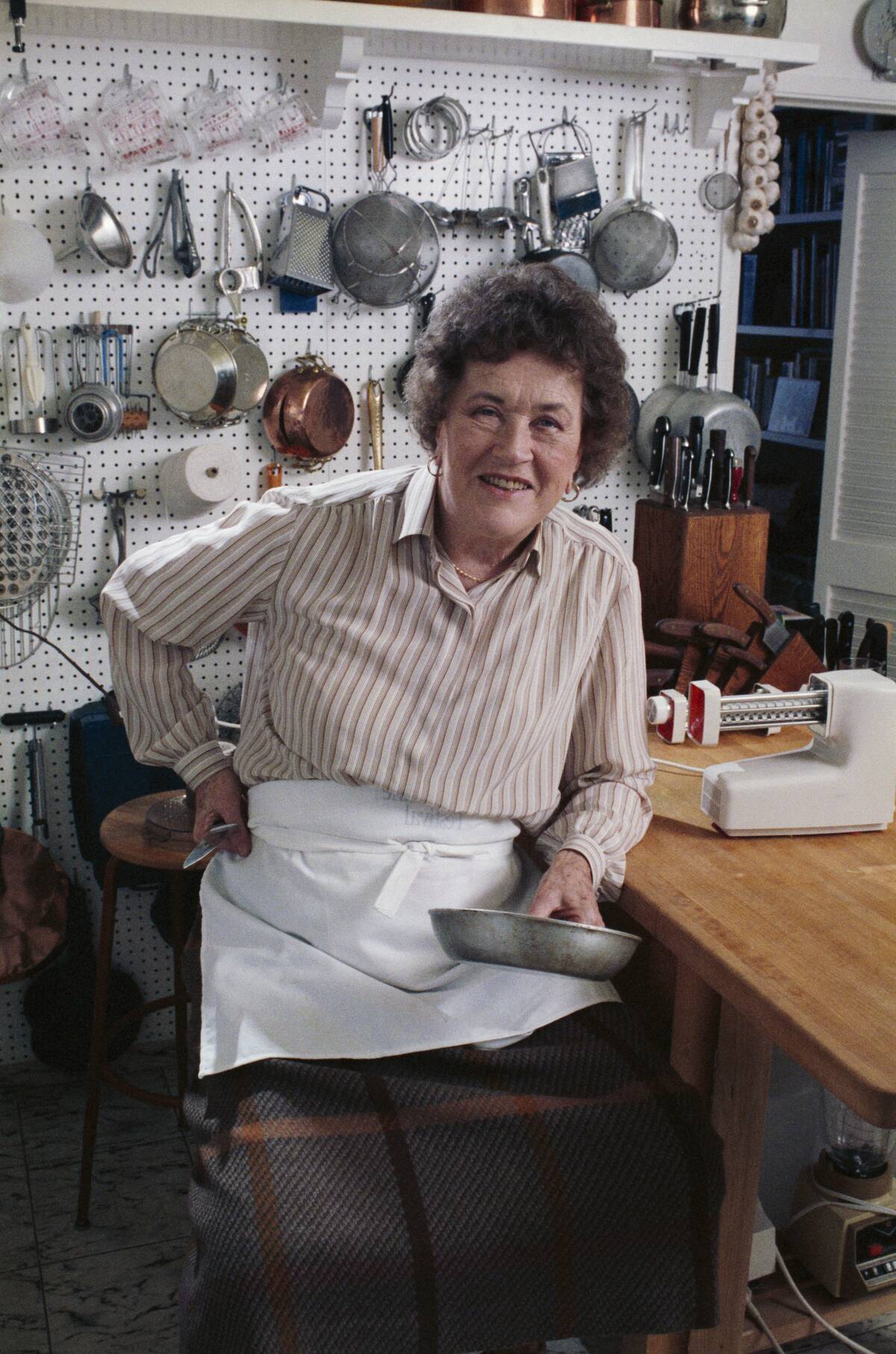 Julia Child Posing in her Kitchen