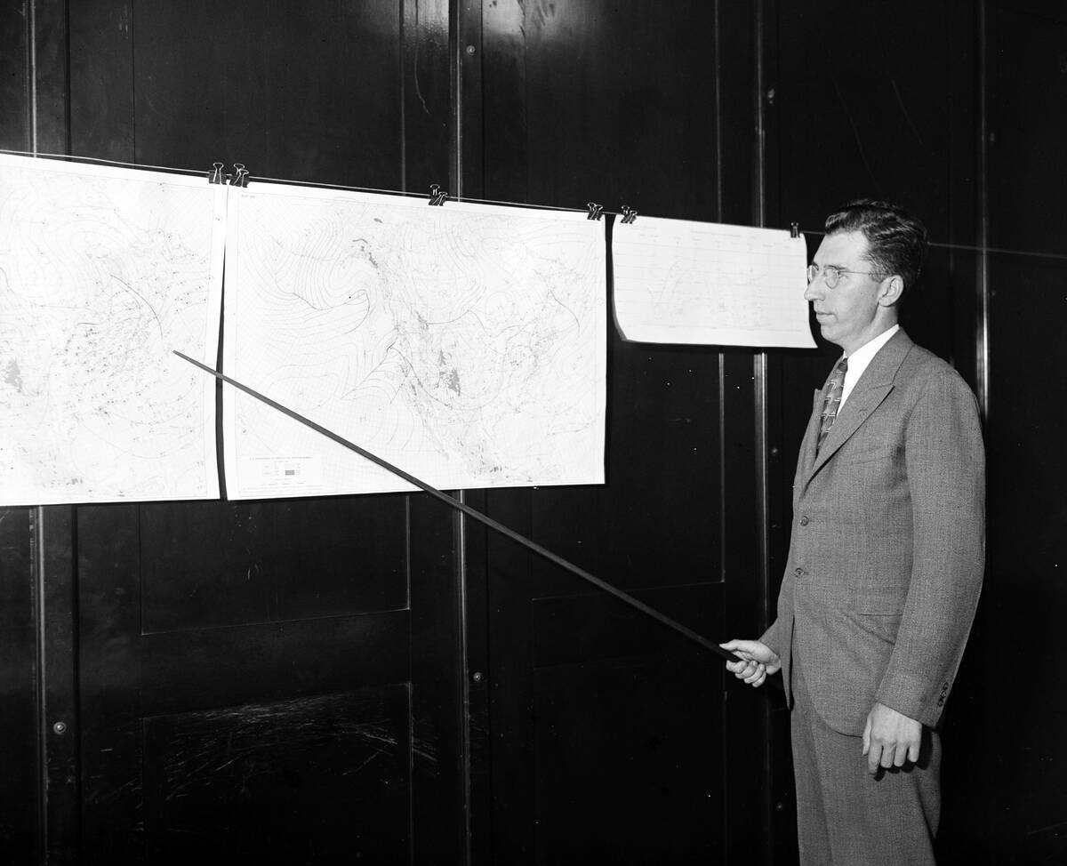Man Pointing To Weather Maps