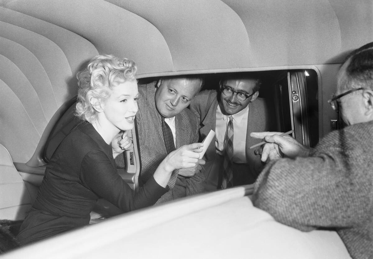 Marilyn Monroe Talking with Reporters from Inside Limousine