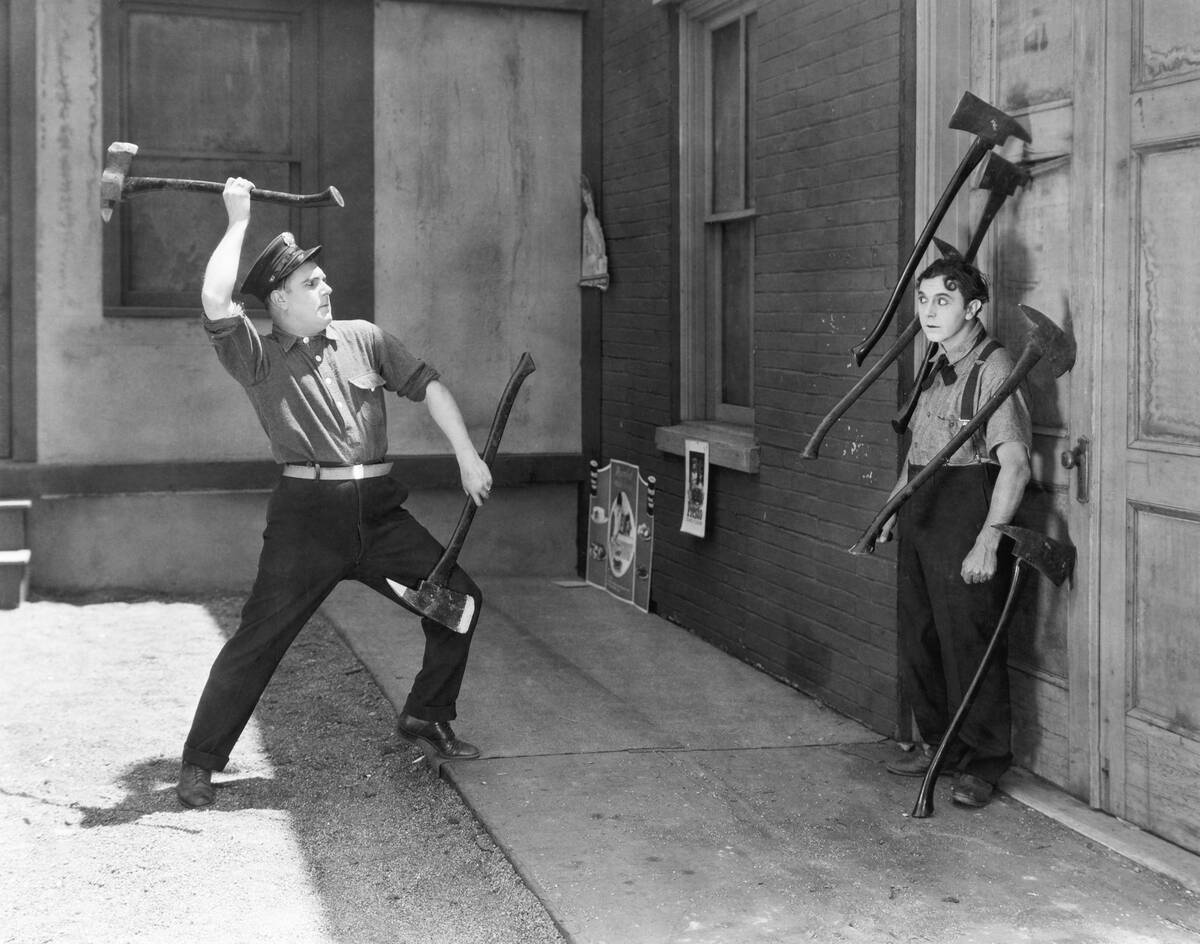 Men Performing Ax Throwing Stunt