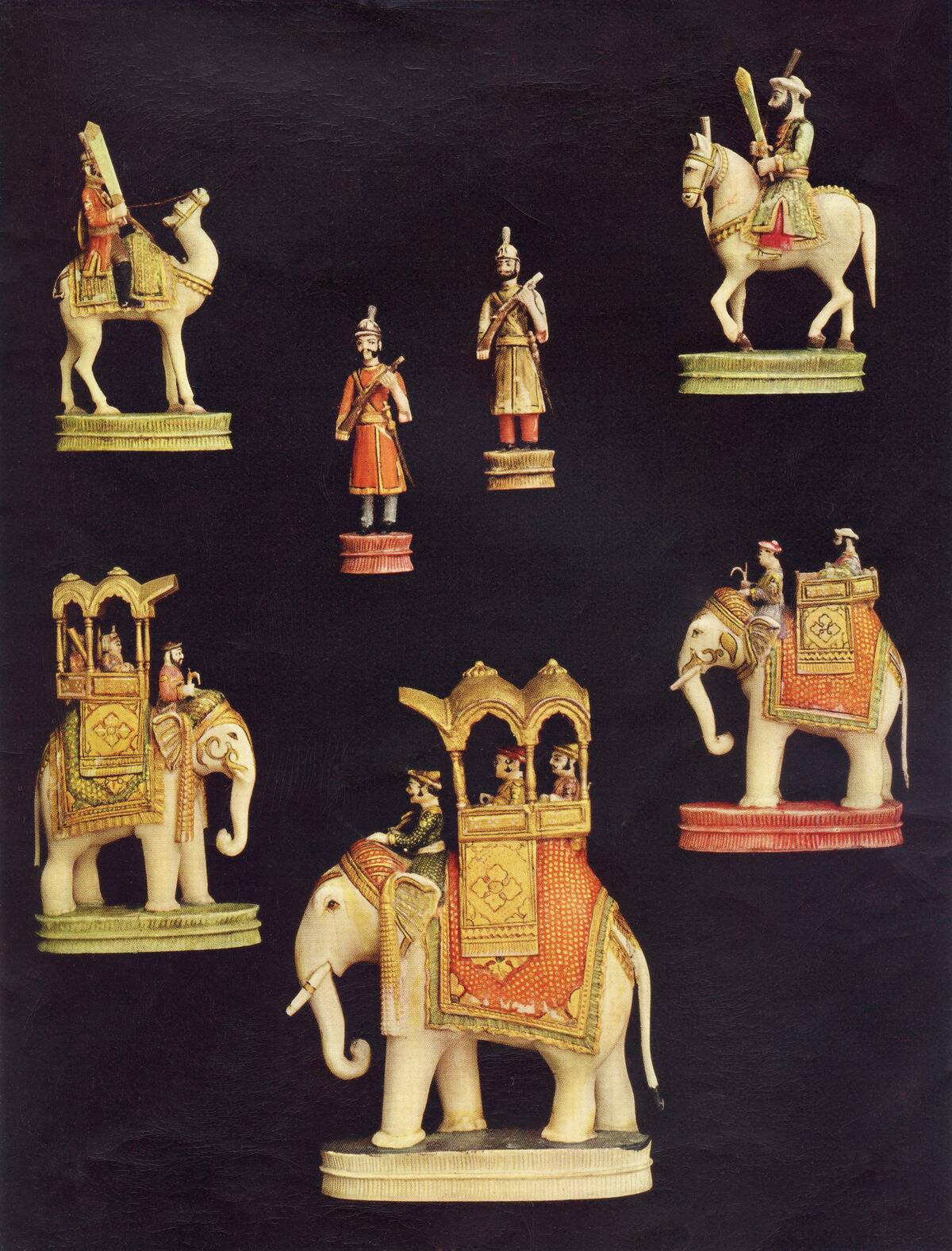 Pieces From A Chess Set In Carved And Coloured Ivory