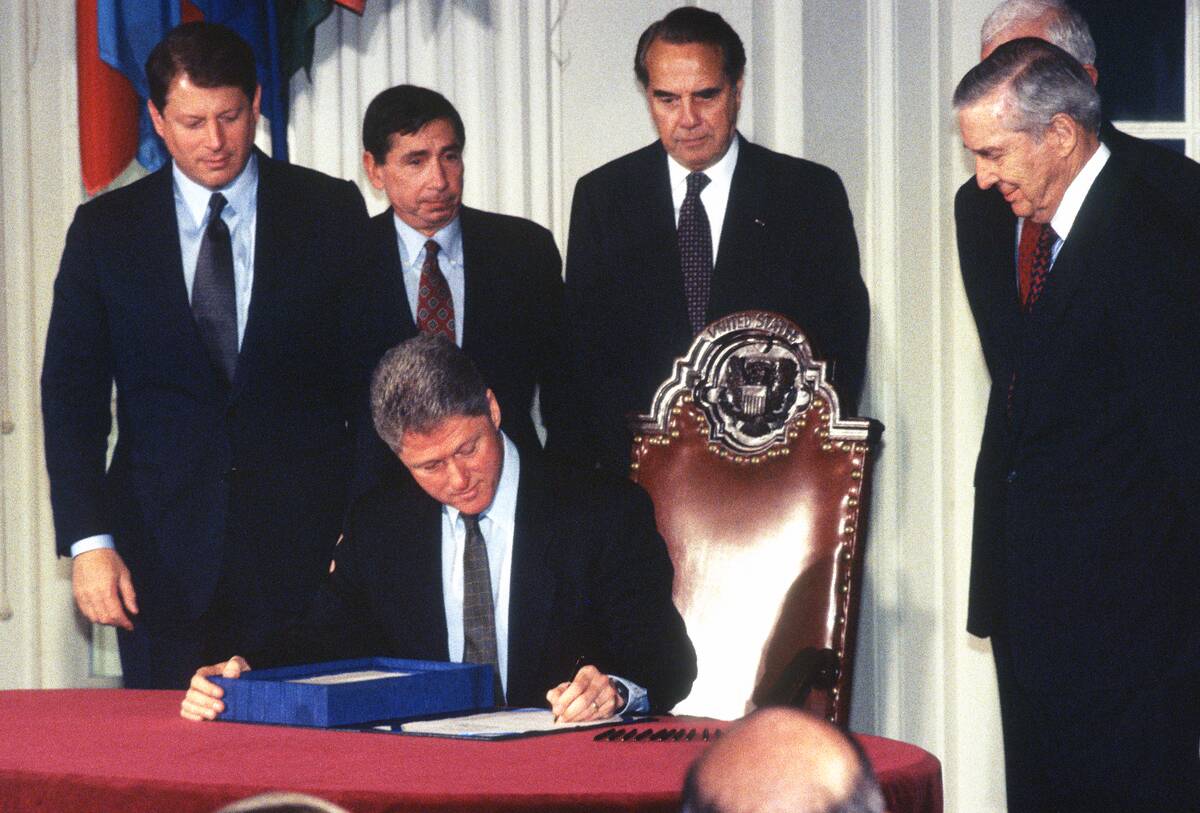 President Clinton Signs The GATT Bill
